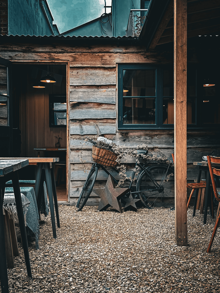 Bicycle with plants in the basket at the secret café shed at the Department of Hope Joy and Wonder in Cheltenham.