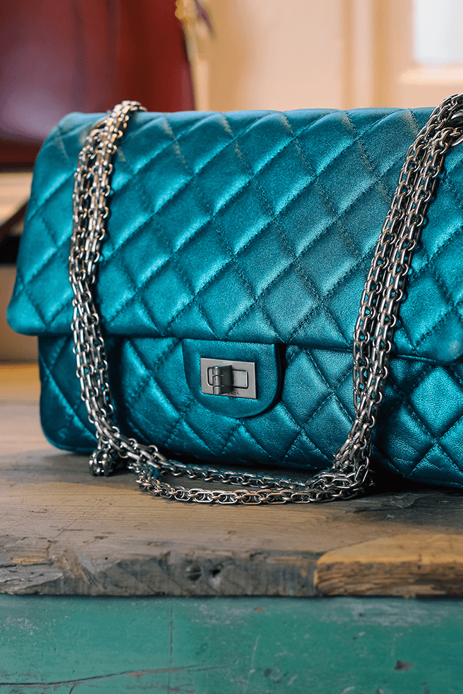 A Constantine Rex blue, quilted, preloved Chanel bag.